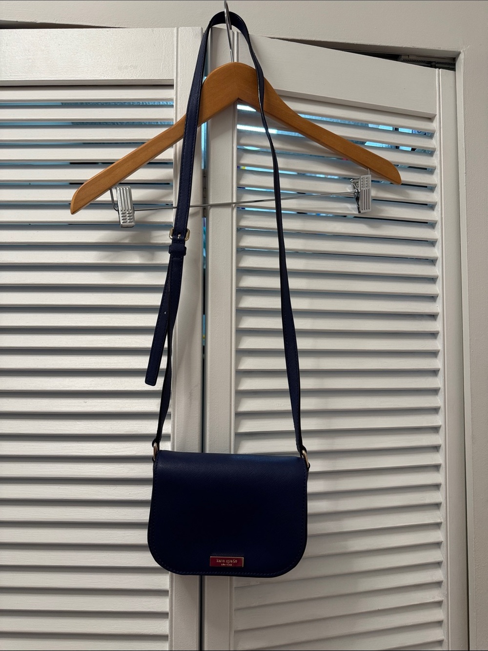 kate spade navy leather crossbody with gold-tone plaque